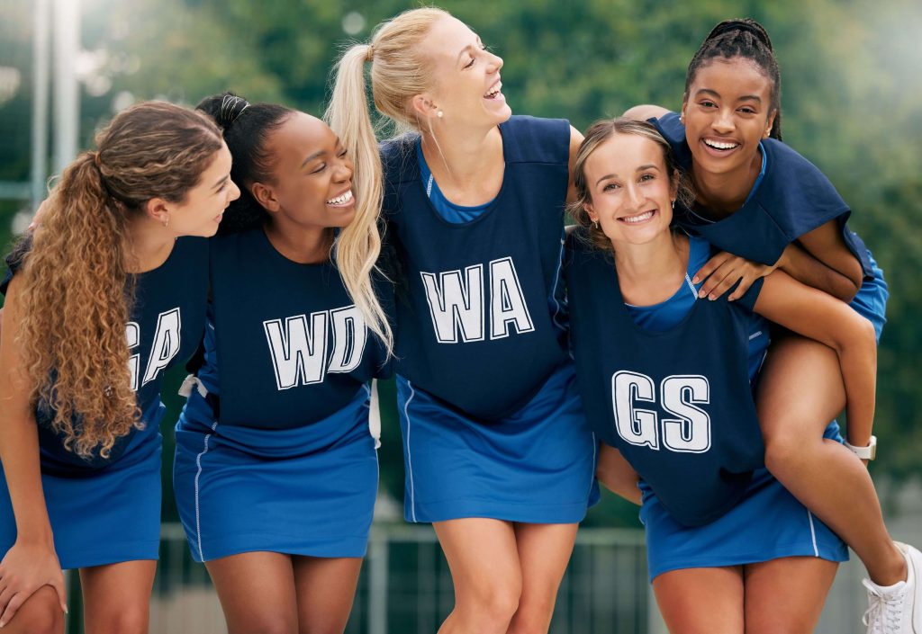 Cheerleading girls in uniforms stand together